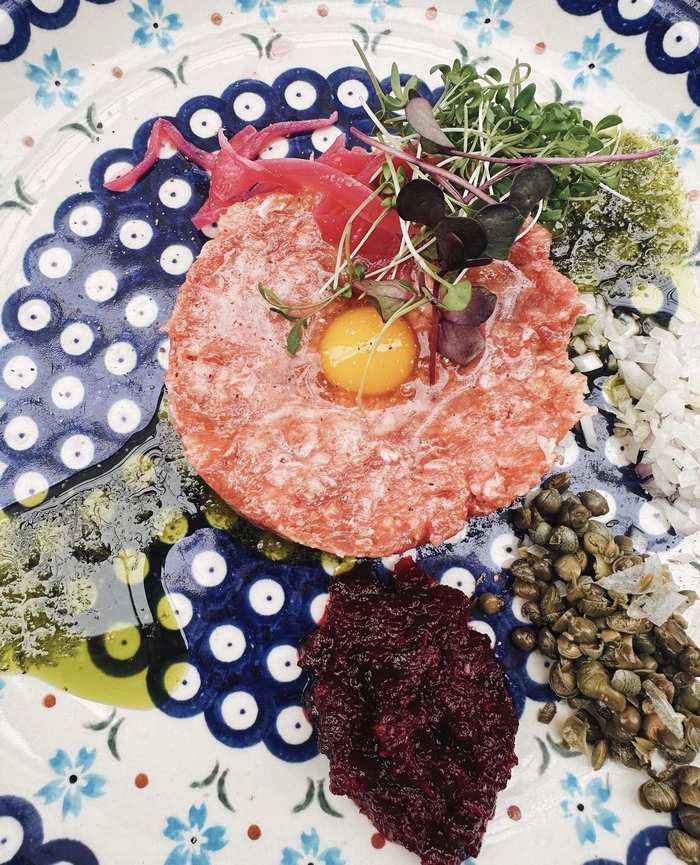 Steak tartar with quail egg, capers and house pickles
